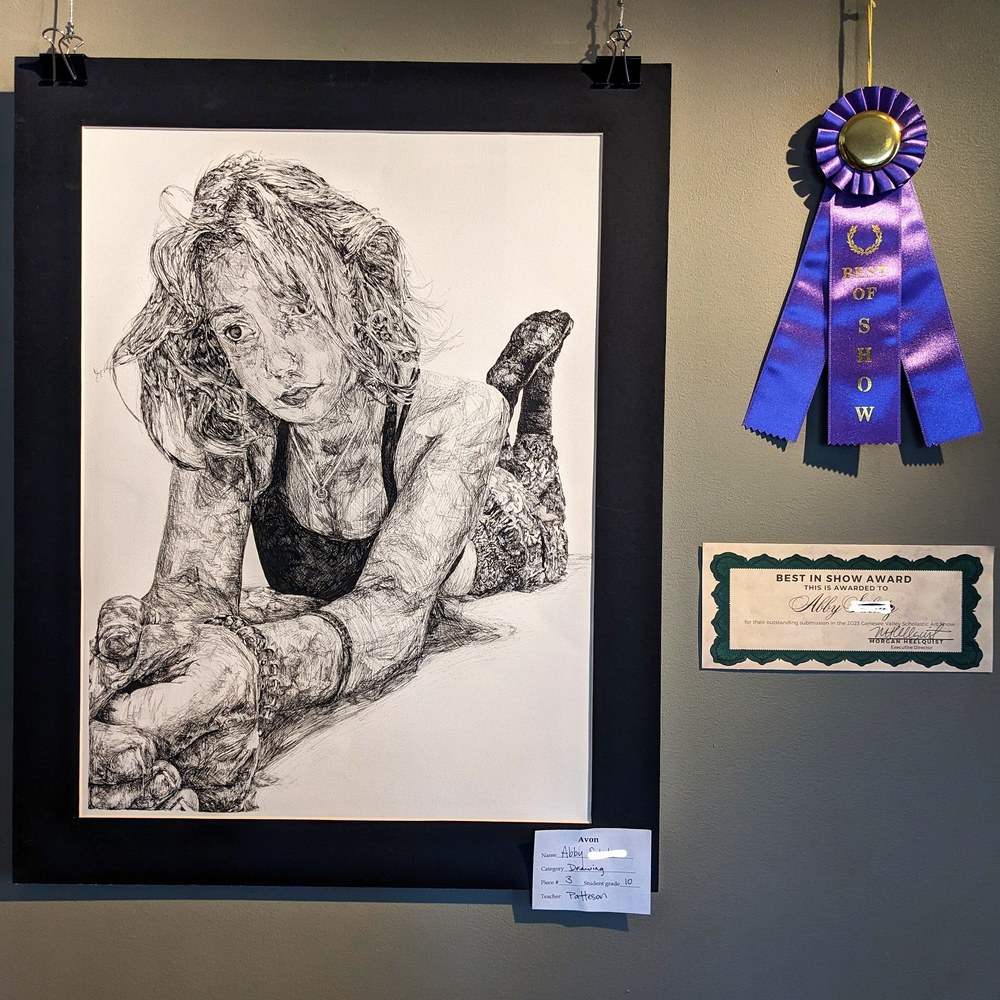 Sophomore Abby S.’s foreshortened self portrait in pen was named best in show. 