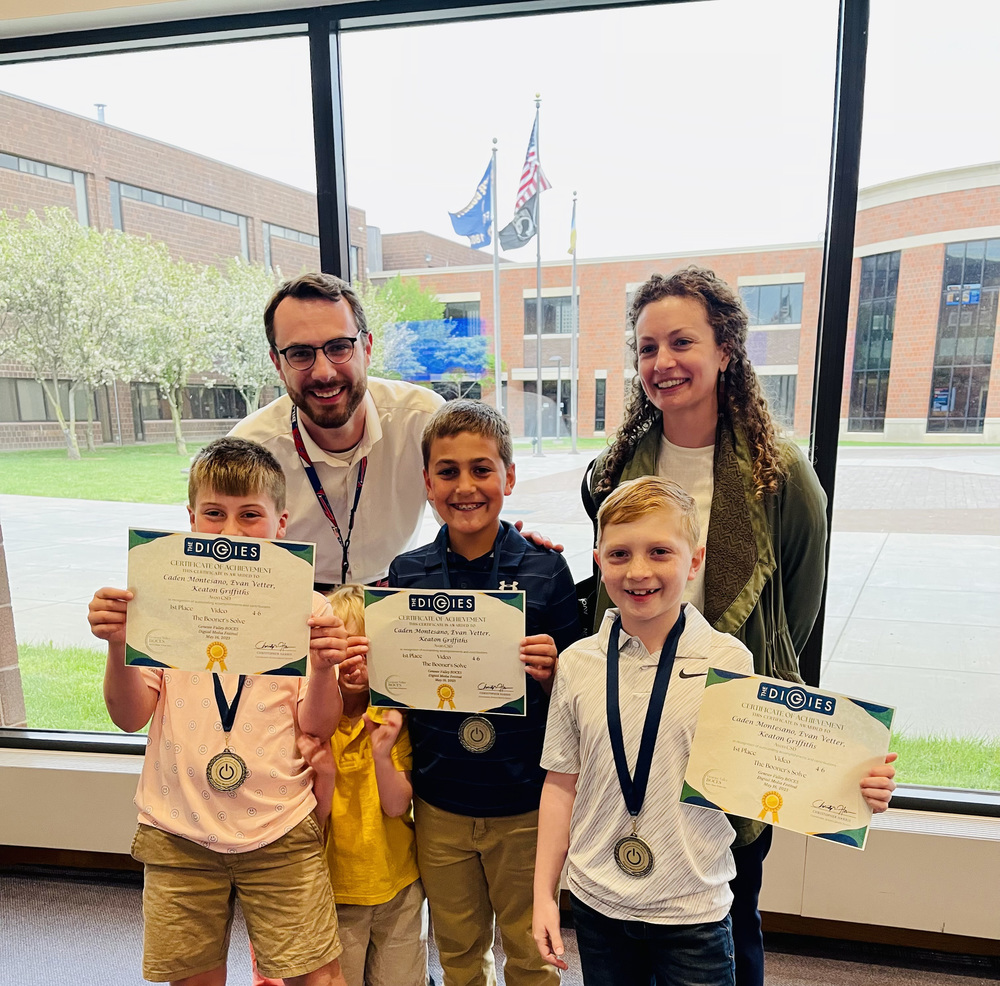 Photo courtesy of Nicole Rowley Evan V., Caden M. and Keaton G, whose stop-motion video, “The Booner’s Solve,” won first place in the video grades four through six category in the 2023 Digies, pose for a photo with classroom teacher Ian Smith and Art Teacher Nicole Rowley at the Digies awards ceremony at Genesee Community College earlier this month.