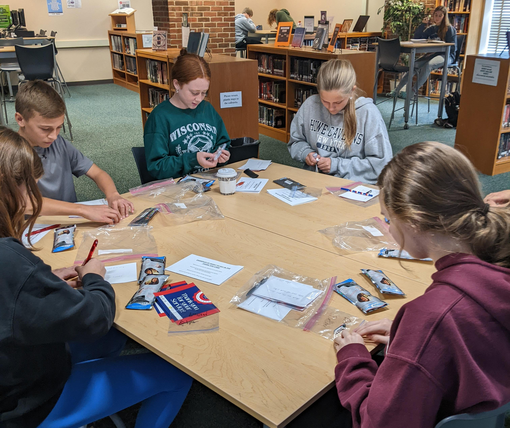 Members of Avon's Interact Club create care packages and thank you cards at their meeting Monday that will be sent to U.S. servicemembers stationed overseas. 