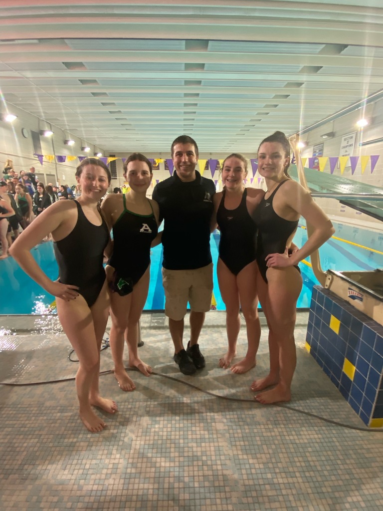   Pictured at Avon’s dual meet against York Jan. 5, 2023 are Claire S., Abby S., Jessie C., Kaitlyn G. and Head Swim Coach Dan Paganin. 