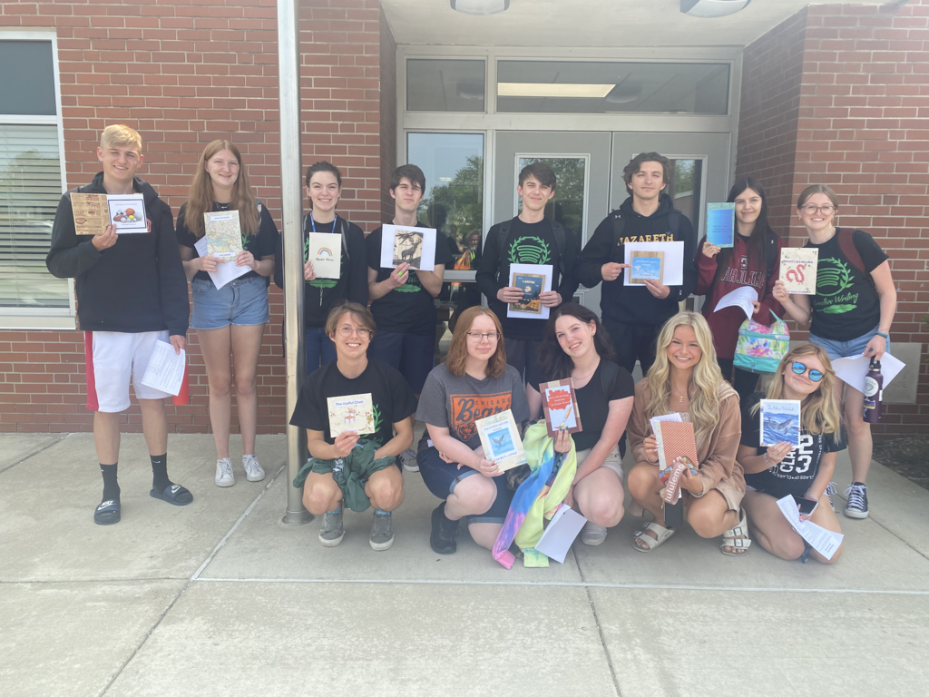 Mrs. Cordula Kennell’s creative writing students are pictured reading children’s books they created to Elementary School students earlier this week. 