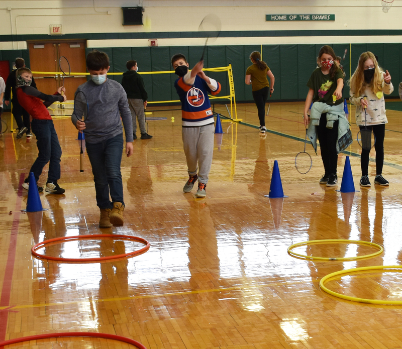 Students practice their serves.