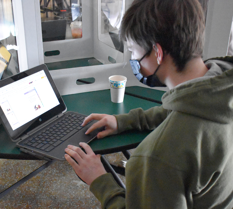 Cael adds the finishing touches to his contribution to the digital recipe collection.